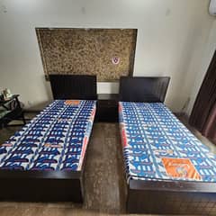 2 single bed, 2 side tables, 2 durafoam mattress, 2 molty pillows