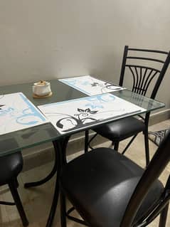 Iron dining table with three chairs
