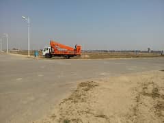 Next to Corner Ideal Location 1 Kanal Plot For Sale Easy Access To 150 Feet Wide Road