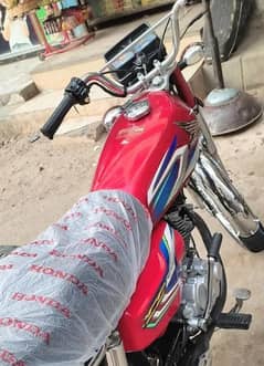 Honda 125 red good conditionr completed file