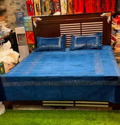 Double bed king size with mattress only display for a bedsheet store