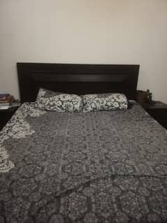 double bed with mirror and dressing table