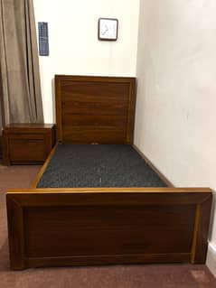 two singles beds with two side tables