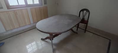 Round dining table with 6 seats available for urgent sale
