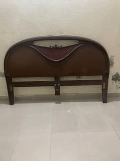 wooden bed with side table