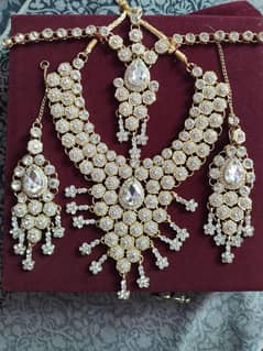 Heavy bridal jewelry set | stone - studded necklace+earrings+mangpatti