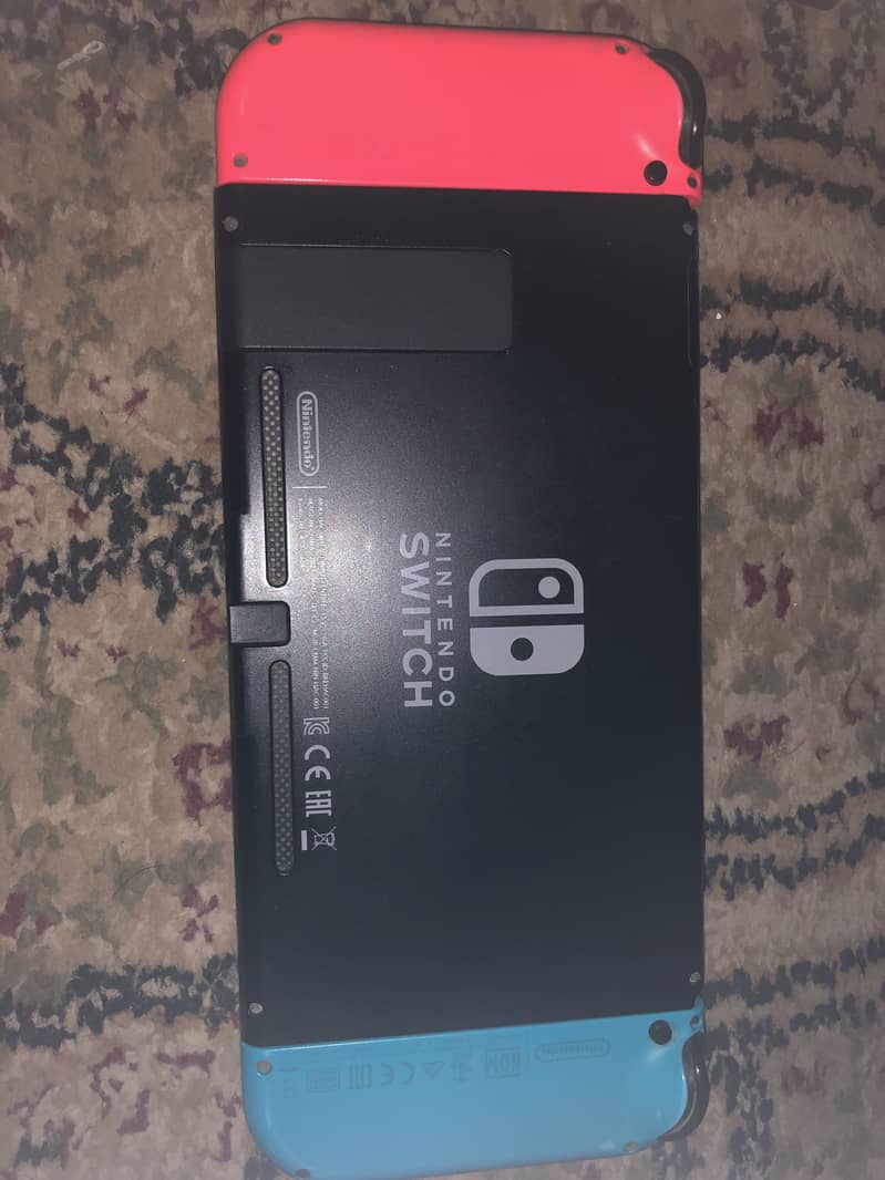Nintendo switch v2 10/10 condition with additional games and case 3