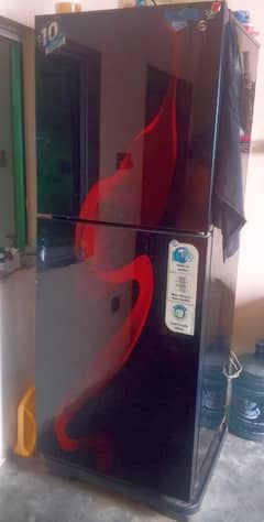 PEL refrigerator, likely a glass door model with a red design element.