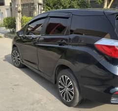 Fit shuttle 2016 hybrid with Paddlers shifter feul average 22/28 Ac
