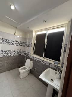 LIKE NEW 1BED 555 SQF APARTMENT FOR SALE IN SECTOR E BAHRIA TOWN LAHORE