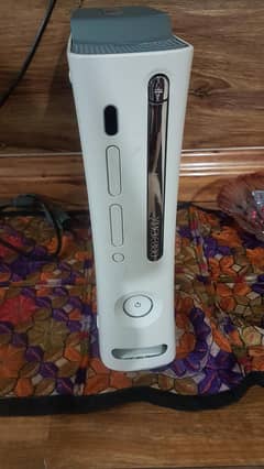 Xbox 360 jasper with 60 games installed and 2 original controller