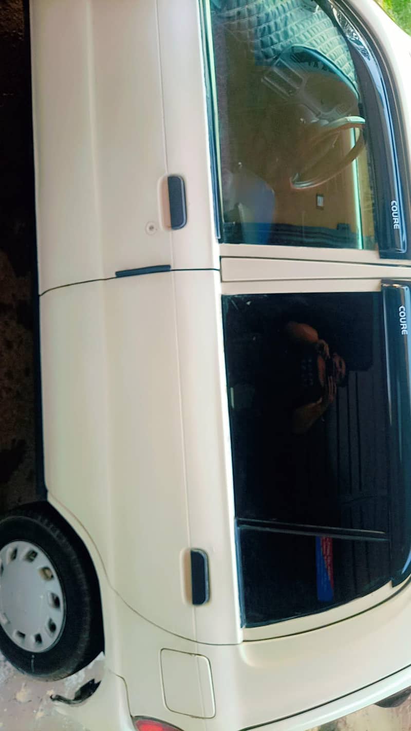 Fully option smart Daihatsu coure 2006 model car with all feature's 4