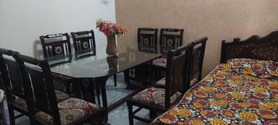 Dinning Table with 8 Wooden chairs ,,, Glass top ,. . .