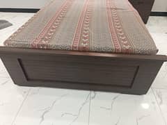 Single bed with mattress and with one side table