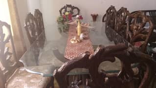 Glass top dining table with 8 wooden chairs