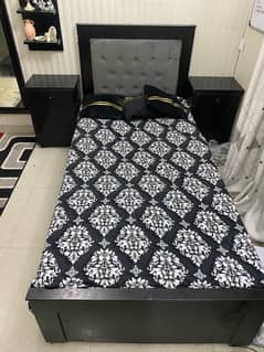 single bed with two side tables