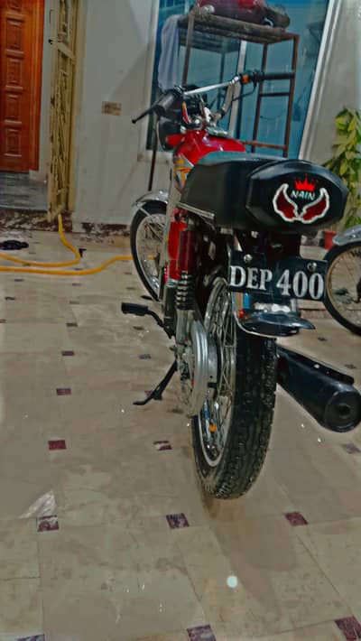 Honda 125 with golden number 400  2023 KY end pr nikla ha