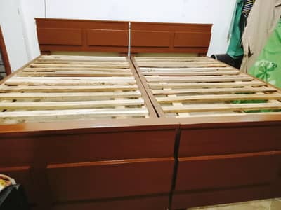 2 wooden single beds
