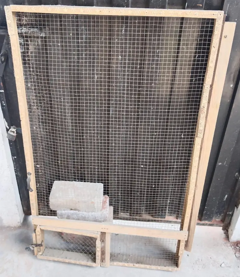 A Cage and Wooden Net Frame — photo 5