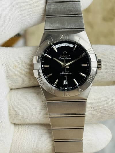 Omega constellation day date automatic black dial.