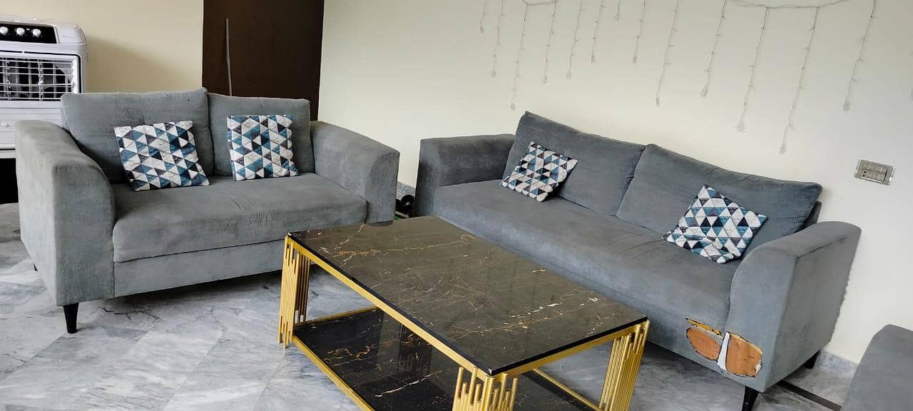 used sofa set with a table 0