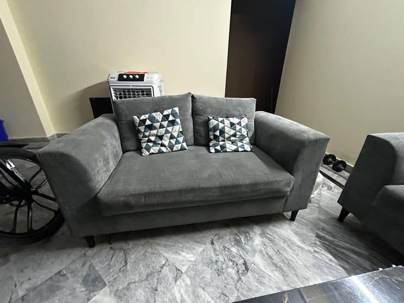 used sofa set with a table 1