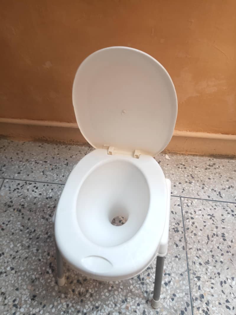 plastic commode and flush tank 0