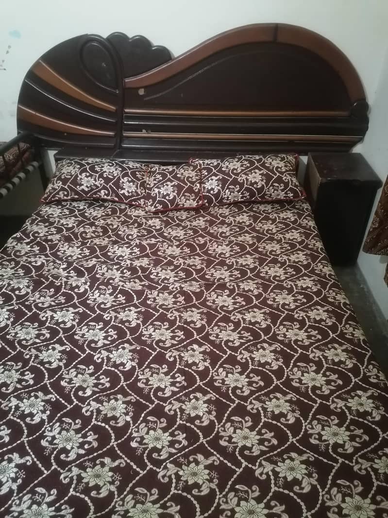 Bed with side table 0