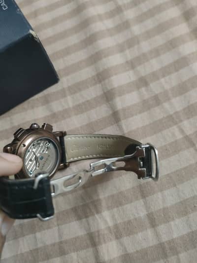 Cartier MTWTFSS watch with a brown dial and black leather strap