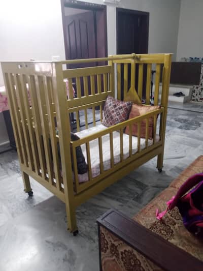 Baby cot metal with wheels and swing feature