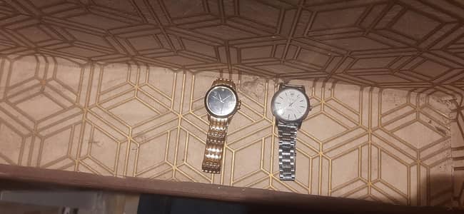 golden and silver  watch
