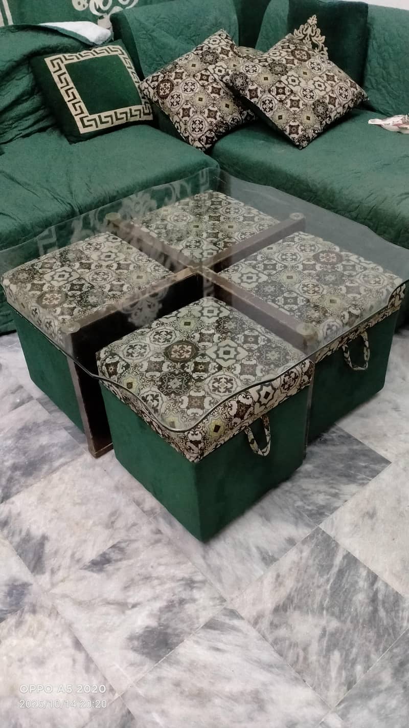 Middle table with four stools. . . 0