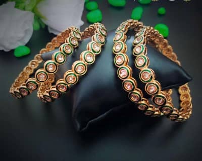 Kundan Bangles in gold and green combination. Made by India.