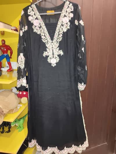 khaadi net dress Brand threads and motifs