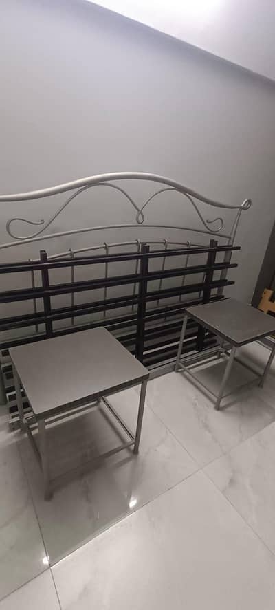 Rod Iron Bed with Side board and mirror frame.