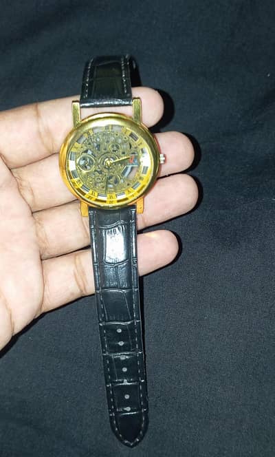 Beautiful watch Black and golden Colour.
