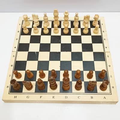 A beautifully crafted wooden 2-in-1 Chess Set and Checkers/Draughts