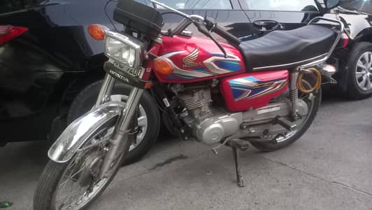 Honda 125 red colour.  single hand use . Good condition