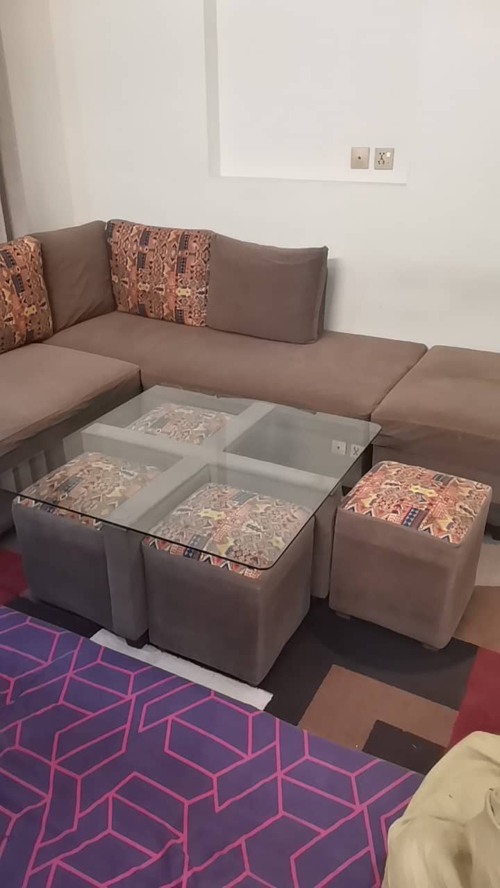 Central table with 4 stools. 0