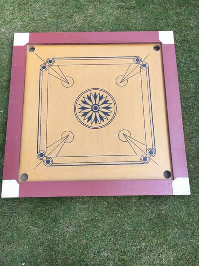 Carrrom Board and it's Coins