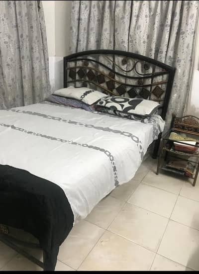 Rot Iron Queen size bed with mattress, 1 Glass Centre Table.