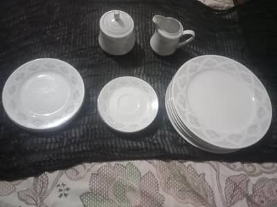 dinner plates,  suger pot and milk pot