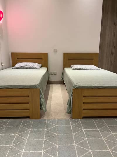 Solid wood single beds x 2