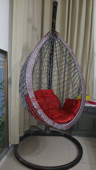 Hanging chair with cushions