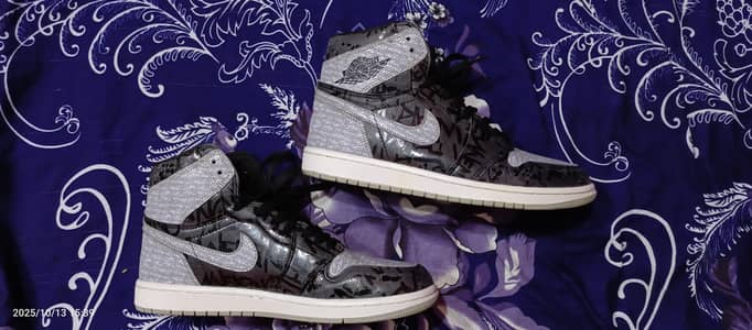 Nike Air Jordan 1. Rebellionaire and Smoked Grey.