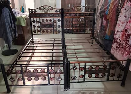 2 single iron beds