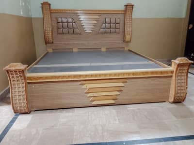 wooden double bed with matress
