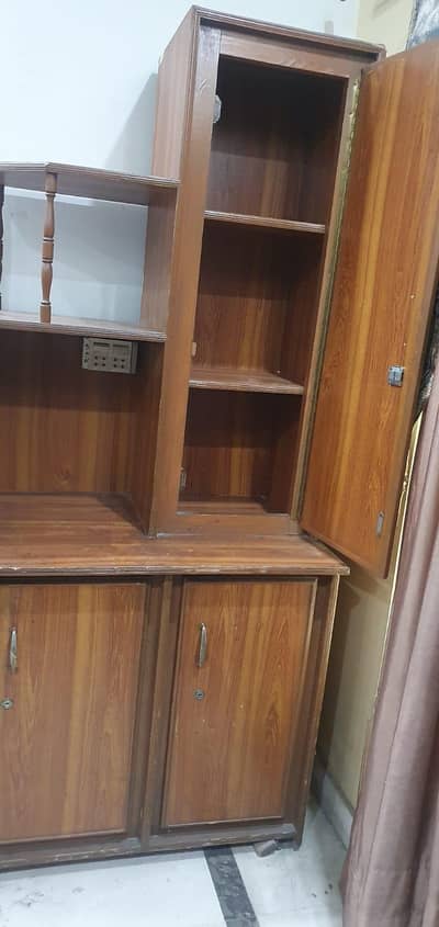 Almirah with cabinets and book selves and tv space