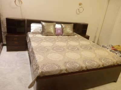 double bed , totally Woden , 10/10 condition , with matres  5 thousand