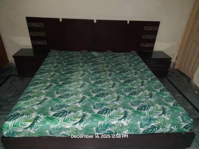 bed with 2 site tables and spring mattress